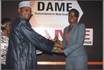 <span  class="uc_style_uc_tiles_grid_image_elementor_uc_items_attribute_title" style="color:#ffffff;">Mallam Abubakar Jijiwa presenting the Presenter of the Year prize</span>
