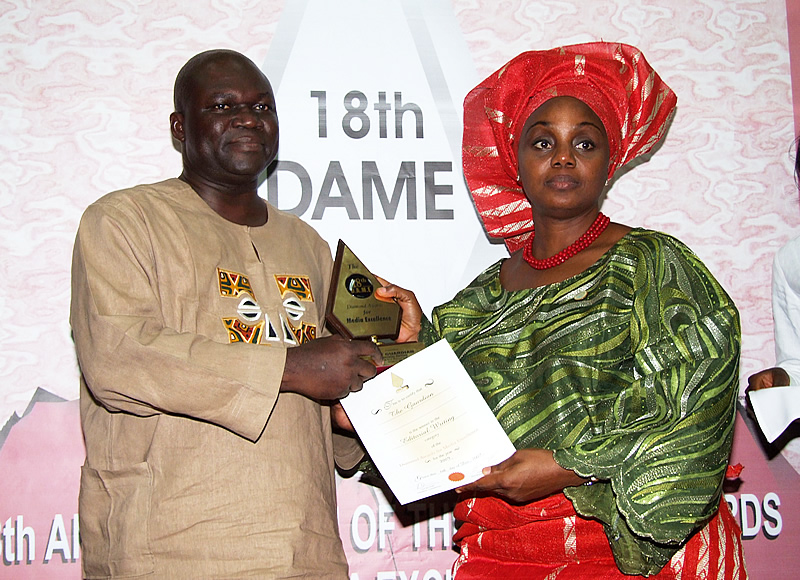<span  class="uc_style_uc_tiles_grid_image_elementor_uc_items_attribute_title" style="color:#ffffff;">Dr. Abati receiving the editorial writing prize for the guardian from mrs. idowu</span>