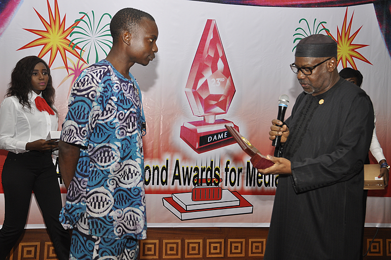 <span  class="uc_style_uc_tiles_grid_image_elementor_uc_items_attribute_title" style="color:#ffffff;">Engr. Ahmed Mansur, E. D. Dangote Group, presenting the Aliko Dangote Prize for Business Reporting</span>
