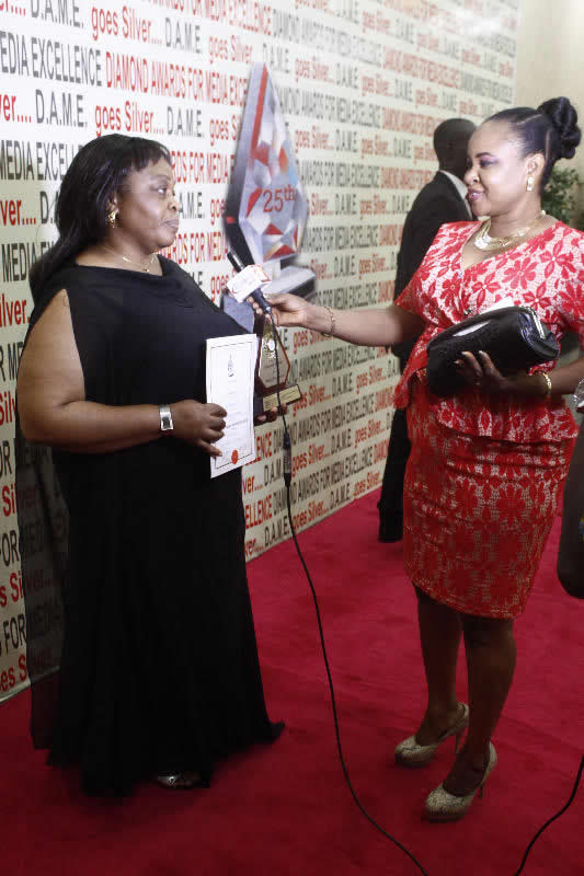 <span  class="uc_style_uc_tiles_grid_image_elementor_uc_items_attribute_title" style="color:#ffffff;">Ify Unachukwu TV Documentarist of the Year being interviewed</span>